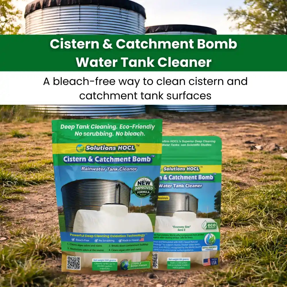 Promotional outdoor shot for Solutions HOCL Cistern & Catchment Bomb Water Tank Cleaner, showing two product boxes in front of cistern tanks on grass and dirt with a green text banner at the top.
