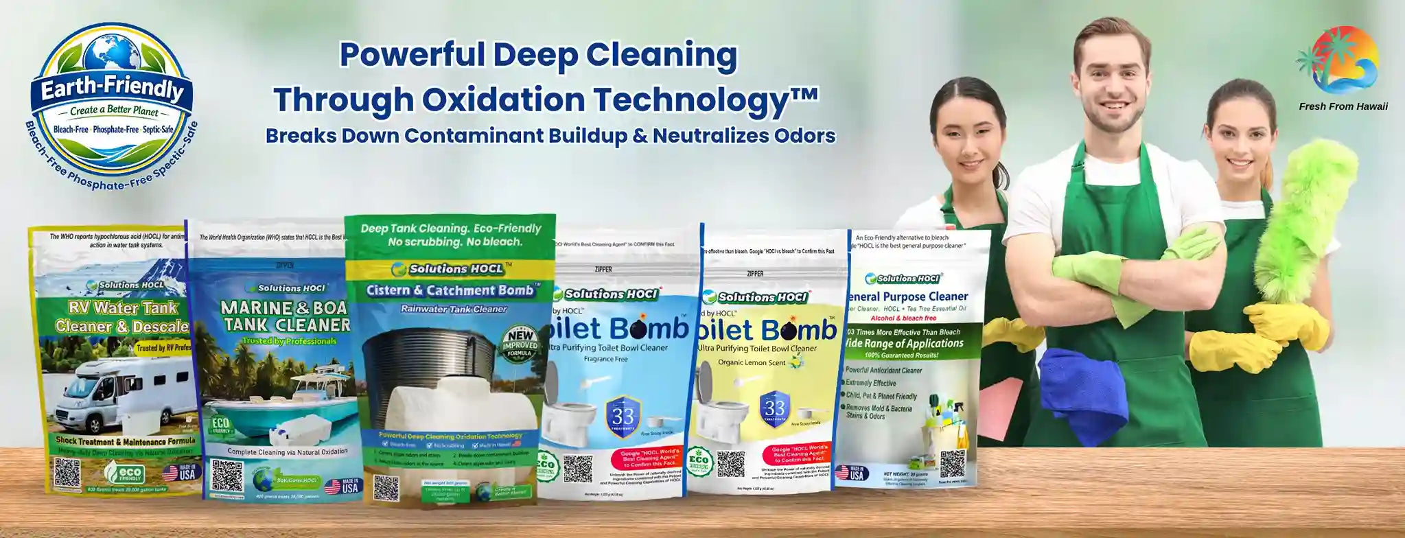 Six Earth-Friendly cleaning product pouches are lined up on a wooden counter in front of a smiling